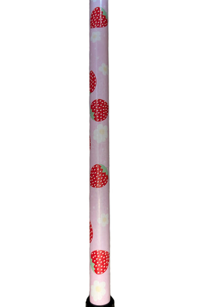 Light pink cylindrical object with red strawberry pattern on a white background